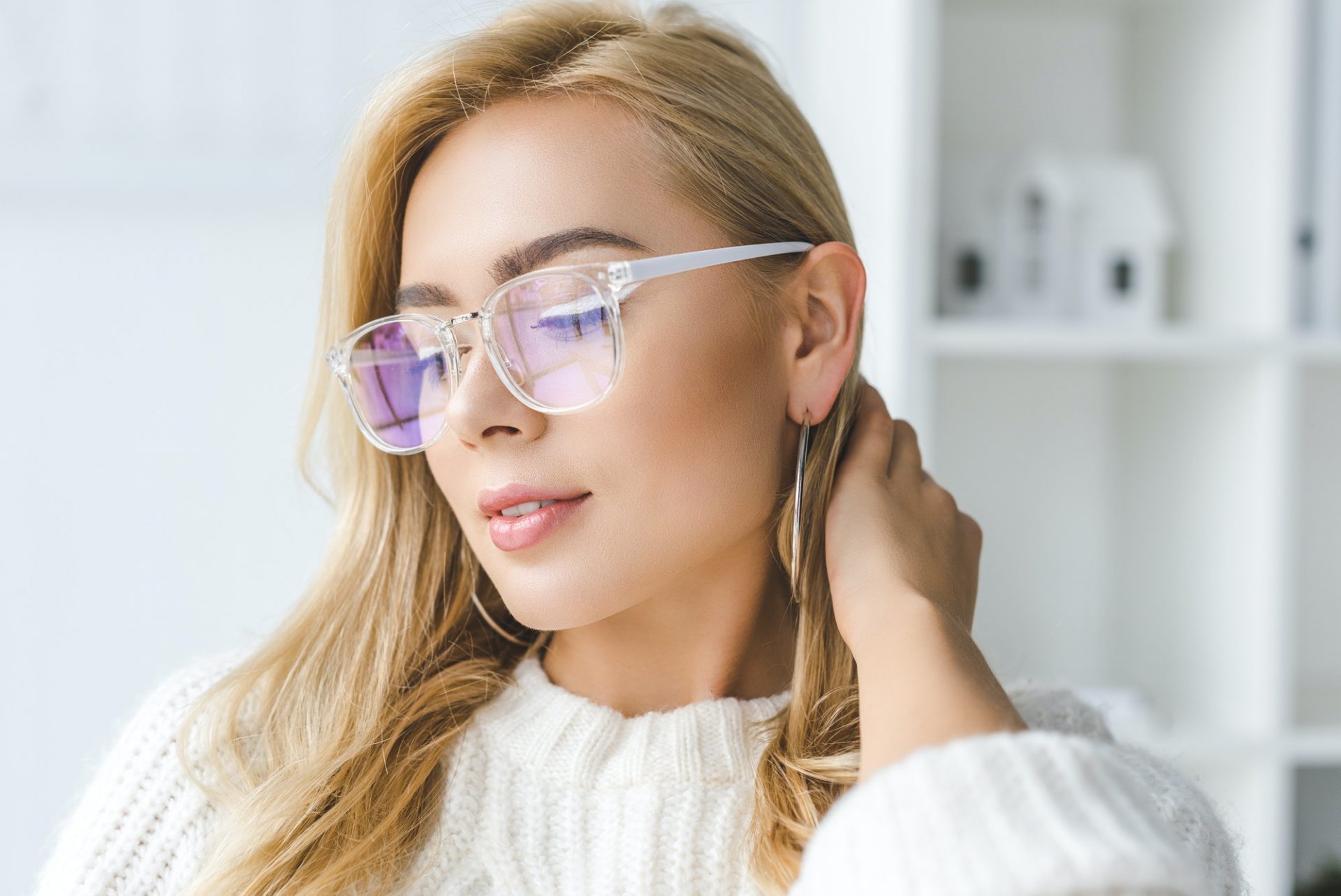 portrait of fashionable attractive blonde woman in eyeglasses